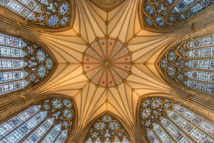 The roof of The Chapter House in York Minster with its incredible stained glass windows